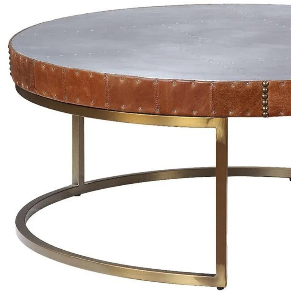 36 Brown And Silver Leather And Metal Round Coffee Table